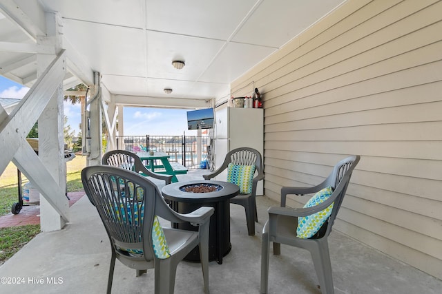 view of patio / terrace with an outdoor fire pit