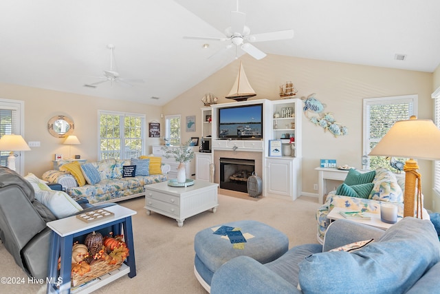 living room with light carpet, vaulted ceiling, and ceiling fan