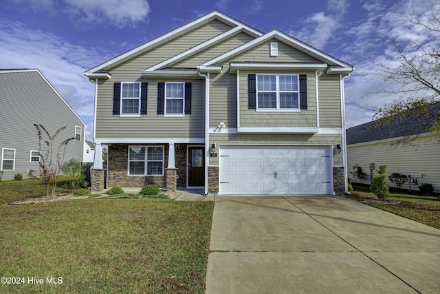 view of front facade with a garage and a front lawn