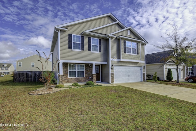 view of front of property featuring a garage and a front yard