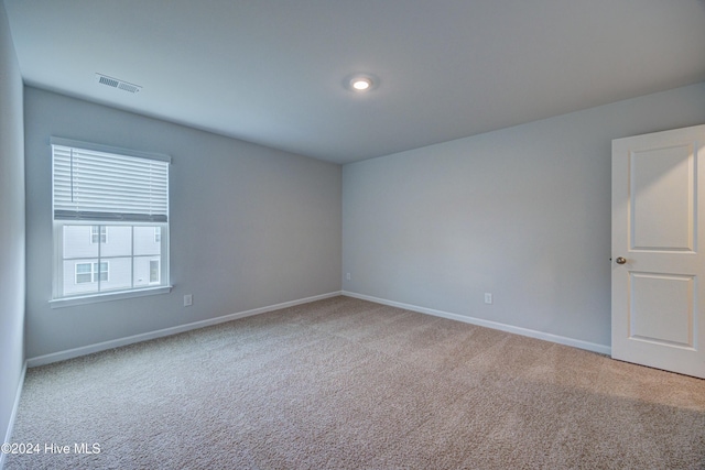 spare room featuring carpet floors