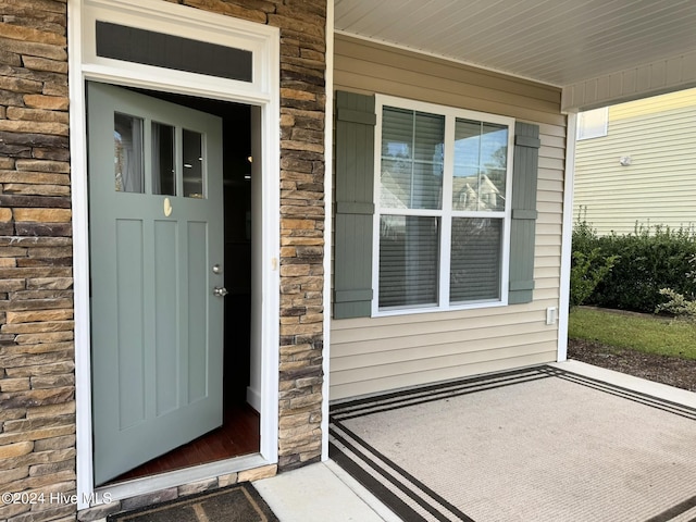 entrance to property with a porch