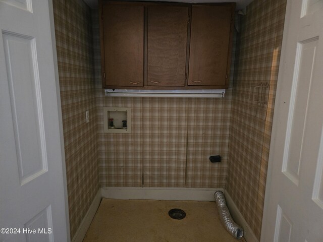 1112 Laurel Ln NW, Wilson, NC 27896 - laundry area featuring washer hookup, cabinet space, wallpapered walls, and baseboards