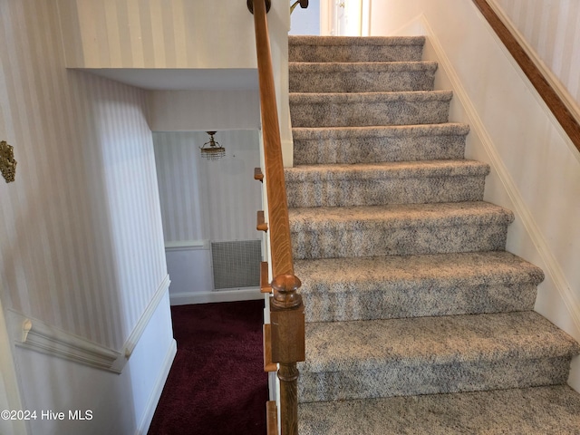 stairway with carpet floors