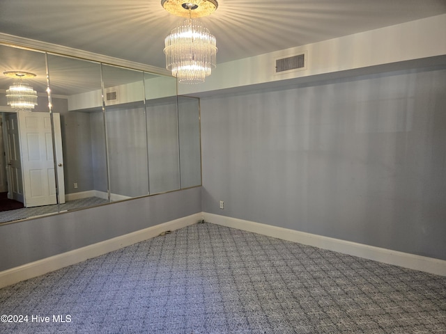 1112 Laurel Ln NW, Wilson, NC 27896 - spare room with a chandelier, carpet flooring, and baseboards