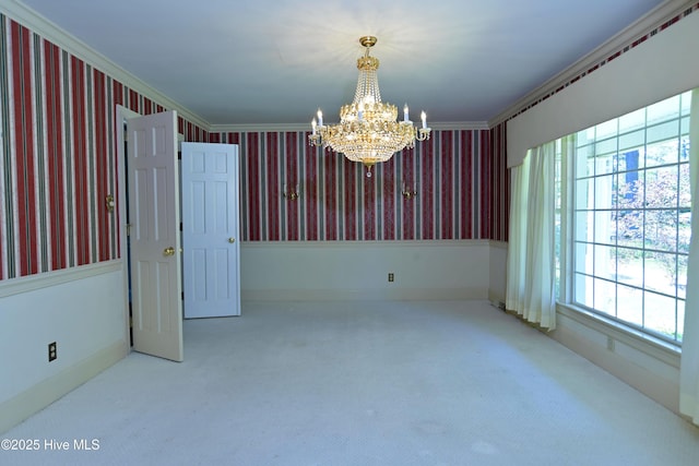1112 Laurel Ln NW, Wilson, NC 27896 - empty room with wallpapered walls, a chandelier, crown molding, and carpet flooring