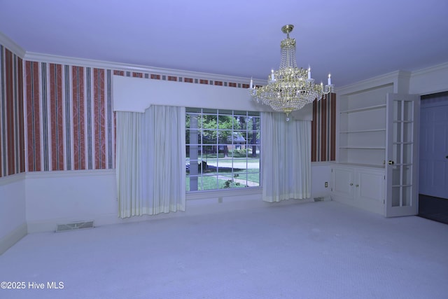 1112 Laurel Ln NW, Wilson, NC 27896 - carpeted spare room featuring a chandelier, crown molding, and wallpapered walls