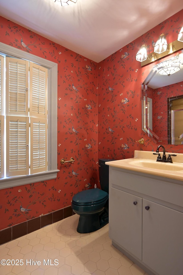 1112 Laurel Ln NW, Wilson, NC 27896 - bathroom with vanity, tile patterned floors, toilet, and baseboards