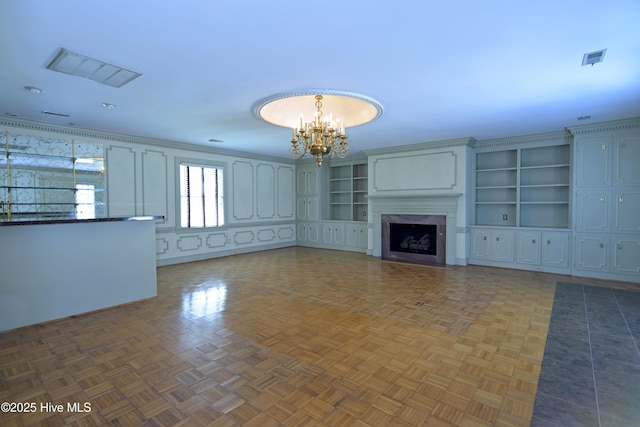 1112 Laurel Ln NW, Wilson, NC 27896 - unfurnished living room featuring a chandelier and a premium fireplace