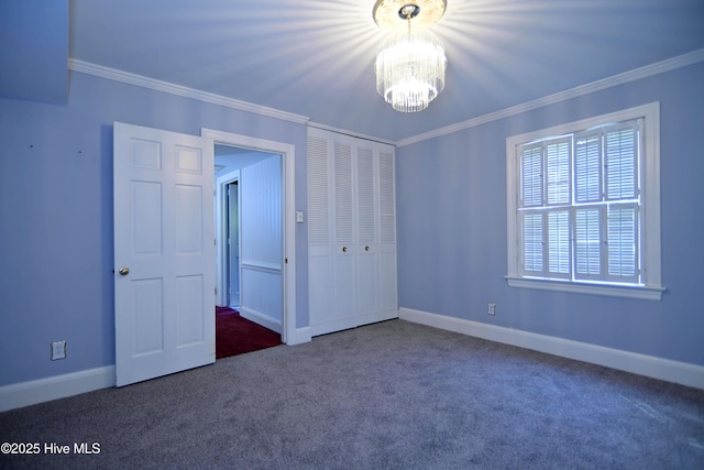 1112 Laurel Ln NW, Wilson, NC 27896 - unfurnished bedroom featuring a chandelier, ornamental molding, carpet, a closet, and baseboards