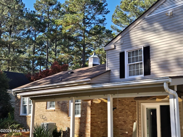 view of side of property featuring central air condition unit