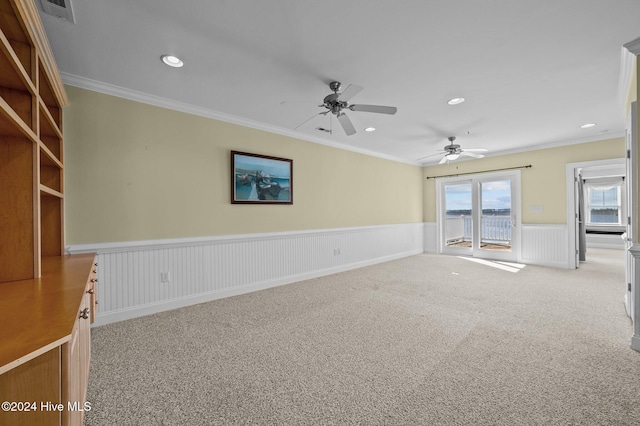 unfurnished living room with crown molding and light colored carpet