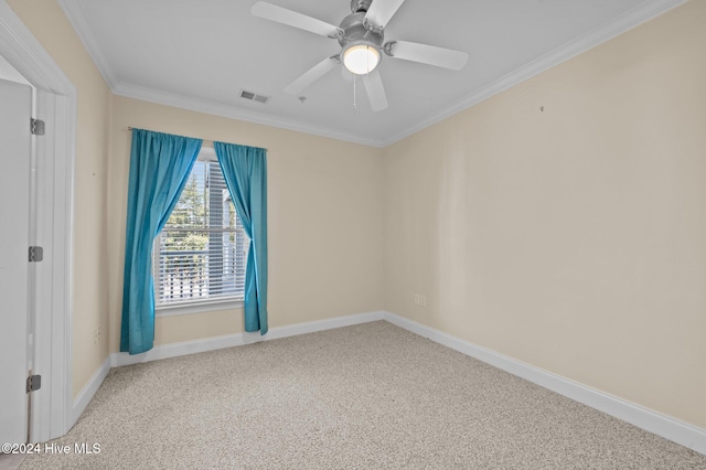 carpeted empty room featuring ceiling fan and ornamental molding