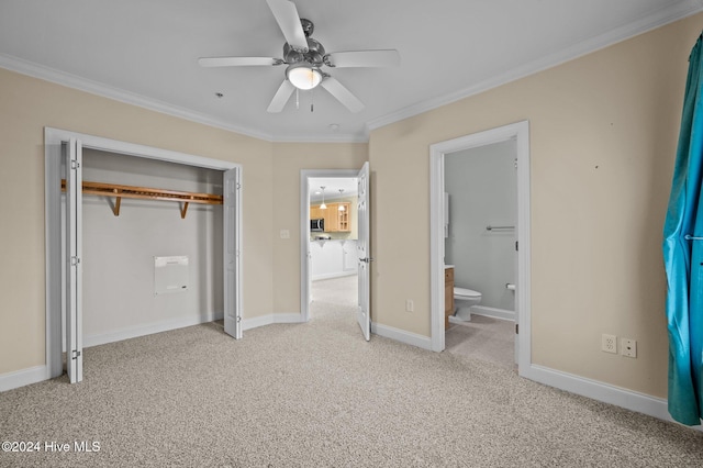 unfurnished bedroom with ornamental molding, light colored carpet, ceiling fan, connected bathroom, and a closet