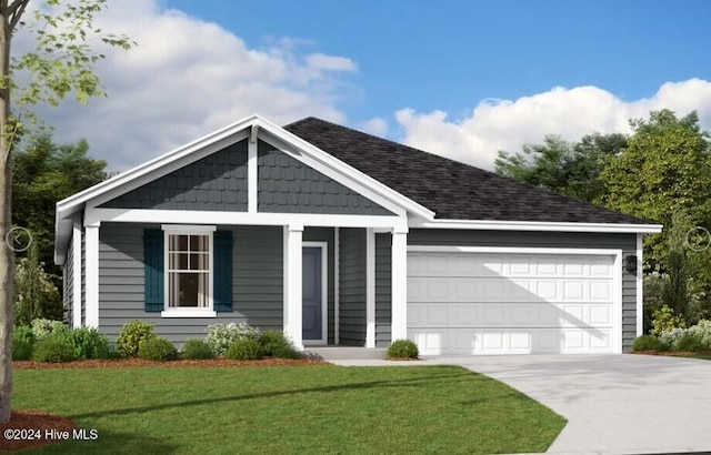 view of front of house featuring a front yard and a garage