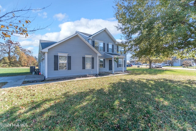 view of front of home featuring a front lawn and a garage