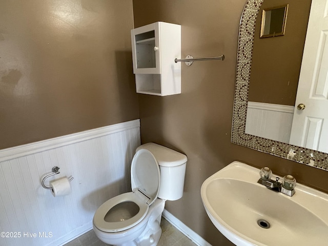 bathroom featuring sink and toilet