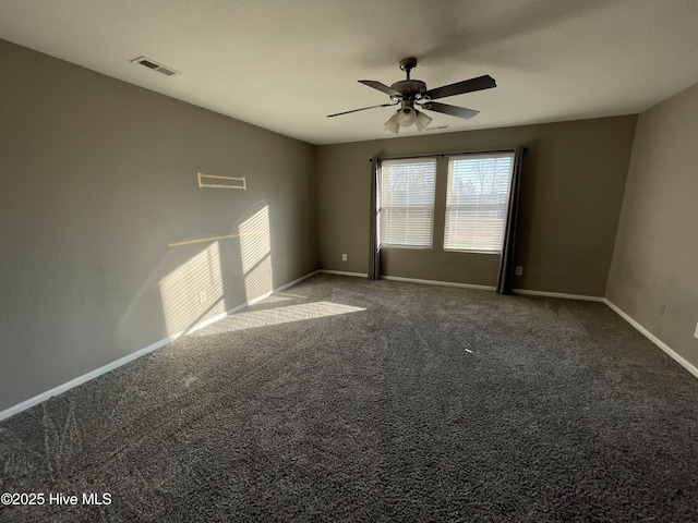 carpeted empty room featuring ceiling fan