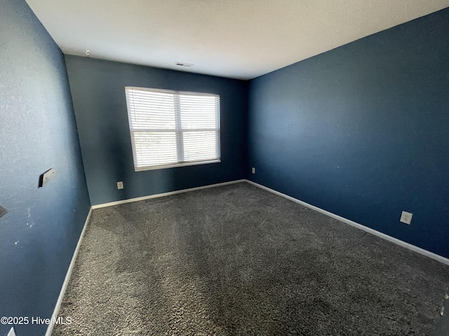 spare room with carpet floors