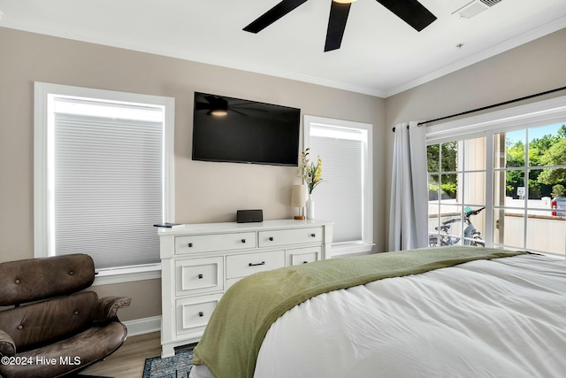 bedroom featuring access to outside, ceiling fan, light hardwood / wood-style floors, and ornamental molding