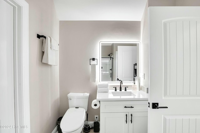 bathroom featuring vanity, toilet, and radiator