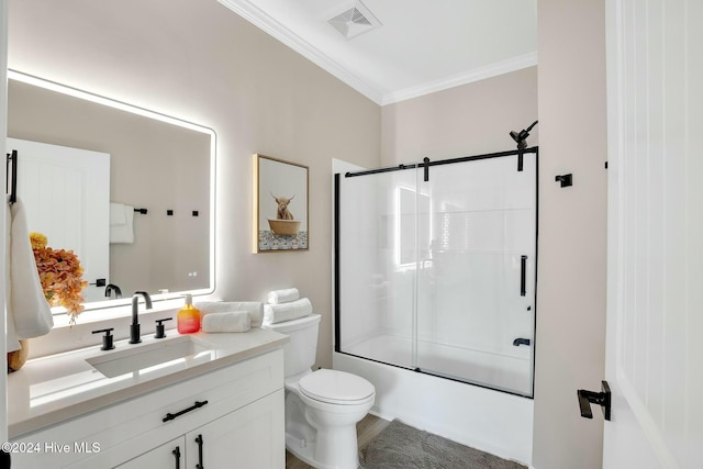 full bathroom featuring vanity, toilet, shower / bath combination with glass door, and ornamental molding