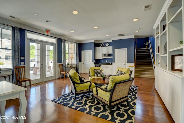 dining space featuring a wealth of natural light, french doors, wood-type flooring, and ornamental molding