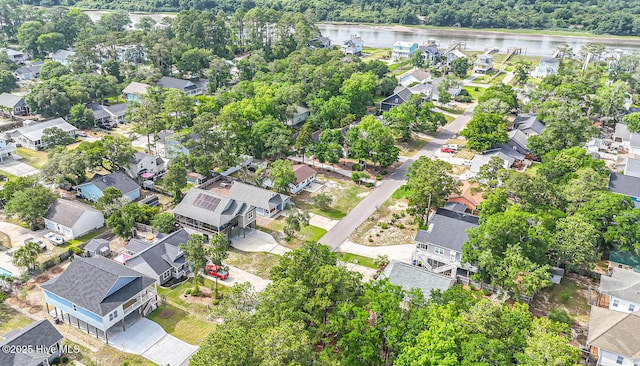 117 NW 17th St, Oak Island, NC 28465 - aerial view of residential area featuring a nearby body of water and a forest