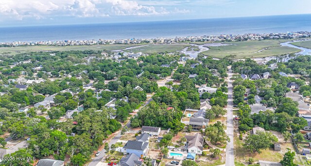117 NW 17th St, Oak Island, NC 28465 - aerial overview of property's location featuring a large body of water and nearby suburban area
