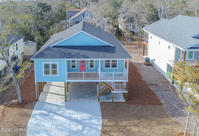 view of front facade featuring a porch and central air condition unit