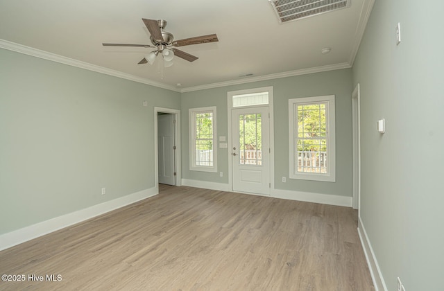 117 NW 17th St, Oak Island, NC 28465 - empty room featuring baseboards, light wood-style floors, a ceiling fan, and crown molding
