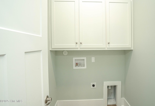 117 NW 17th St, Oak Island, NC 28465 - washroom with hookup for an electric dryer, washer hookup, cabinet space, and baseboards