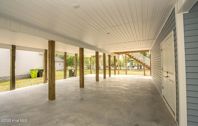 117 NW 17th St, Oak Island, NC 28465 - view of patio with stairway and a carport