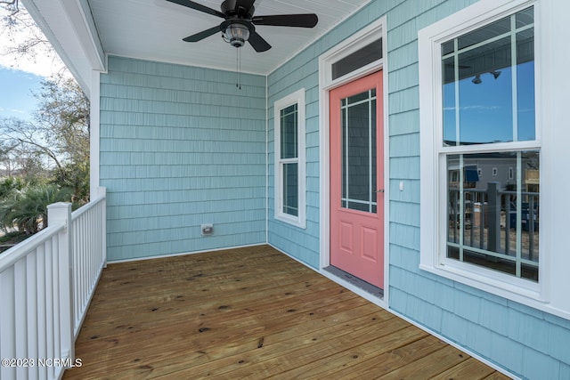 wooden terrace featuring ceiling fan