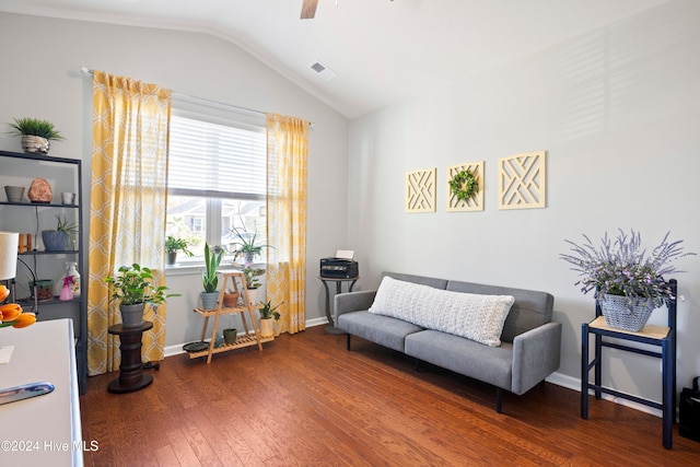 sitting room with dark hardwood / wood-style floors, ceiling fan, and vaulted ceiling