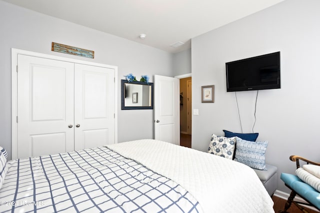 bedroom featuring a closet and wood-type flooring