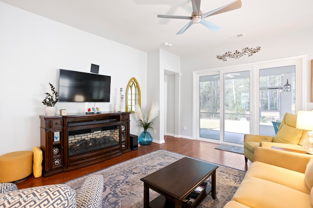 living room with wood-type flooring and ceiling fan