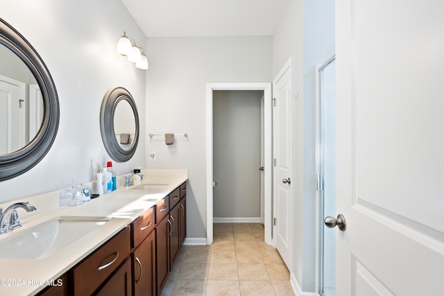 bathroom with tile patterned flooring and vanity