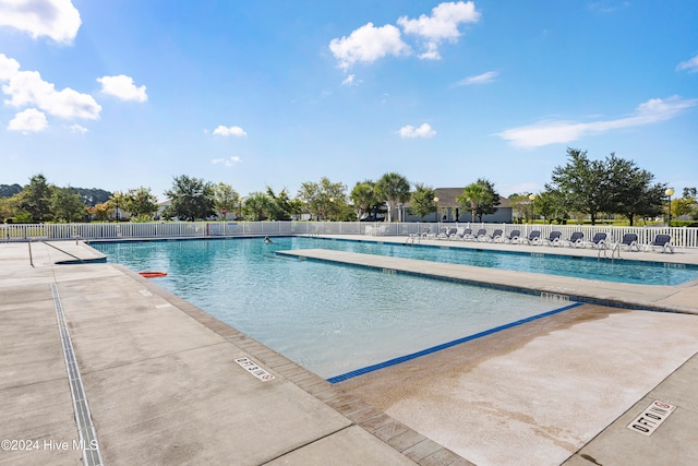 view of pool featuring a patio area