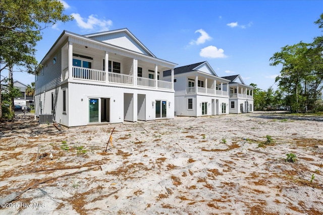 822 Kenneth Ave Unit 1, Carolina Beach, NC 28428 - rear view of house featuring a balcony