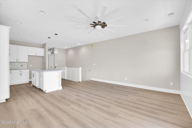 822 Kenneth Ave Unit 1, Carolina Beach, NC 28428 - unfurnished living room featuring light wood-style floors, ceiling fan, and recessed lighting