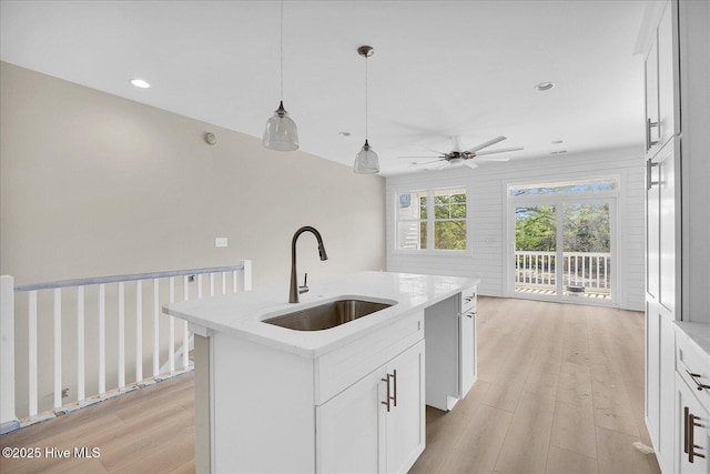 822 Kenneth Ave Unit 1, Carolina Beach, NC 28428 - kitchen featuring a ceiling fan, light wood-style flooring, a kitchen island with sink, pendant lighting, and recessed lighting