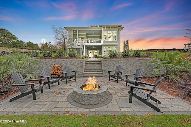 patio terrace at dusk with an outdoor fire pit