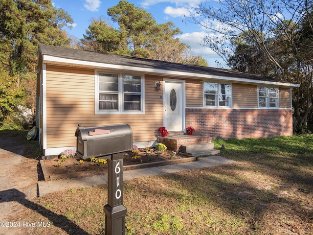 view of front of home with a front yard