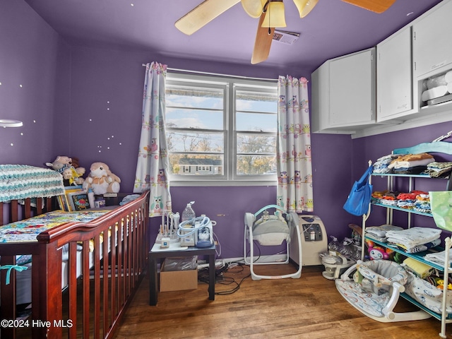 bedroom with ceiling fan and wood-type flooring