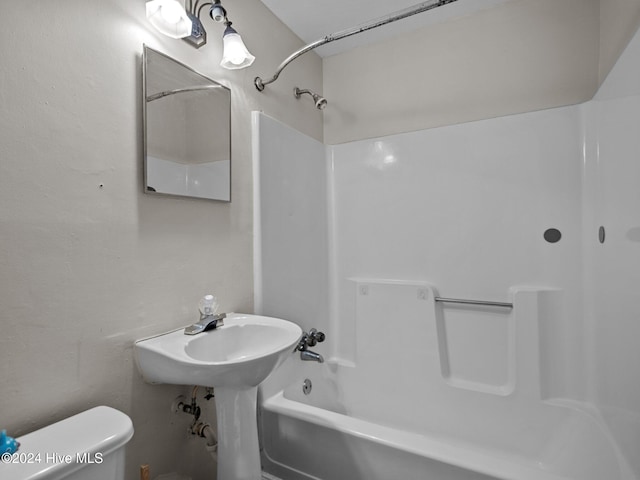 full bathroom featuring bathing tub / shower combination, sink, and toilet