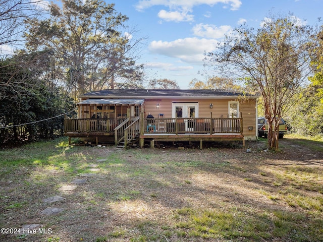 rear view of house with french doors and a deck