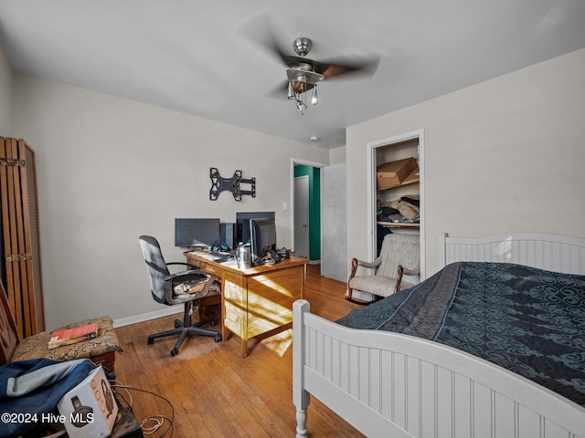 bedroom featuring ceiling fan and hardwood / wood-style flooring