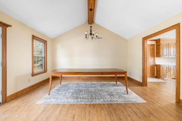 unfurnished office featuring vaulted ceiling with beams, light wood-type flooring, and an inviting chandelier