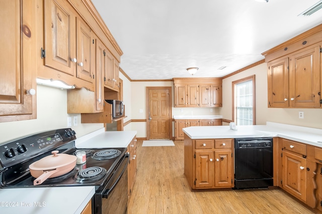 kitchen featuring kitchen peninsula, light hardwood / wood-style floors, ornamental molding, and black appliances